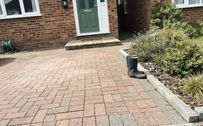 Clean, well-maintained block paving driveway with tidy edges outside a house for sale